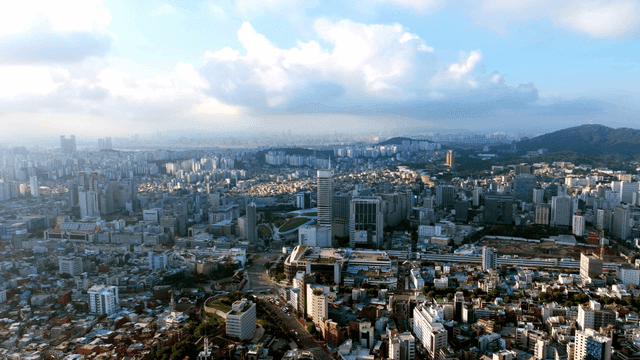 Sprawling cityscape under a blue sky