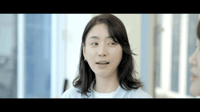 Two women having a conversation indoors
