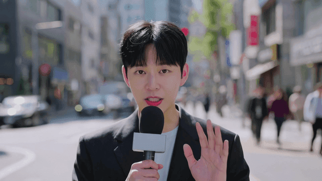 Reporter speaking on busy city street.