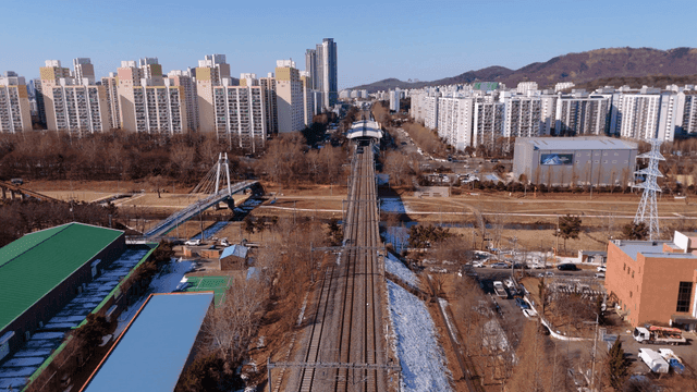 Railway tracks leading into a cityscape