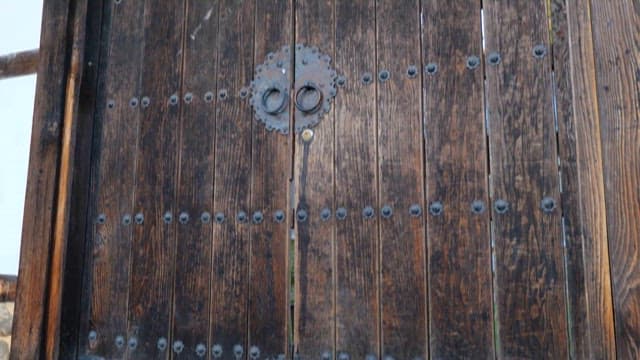 Woman Wearing Hanbok Entering a Korean Traditional House