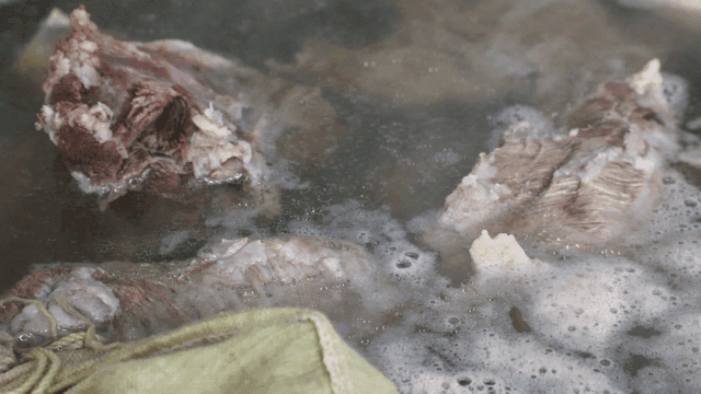 Meat boiling in a steaming pot