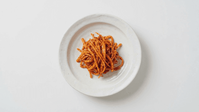 Plate of seasoned burdock root salad