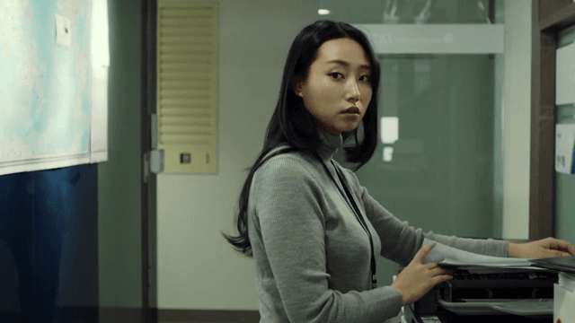 Woman using a copier in an office