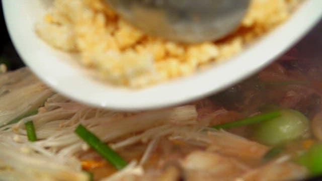 Seafood Scorched Rice Soup Cooked in a Hot Pan