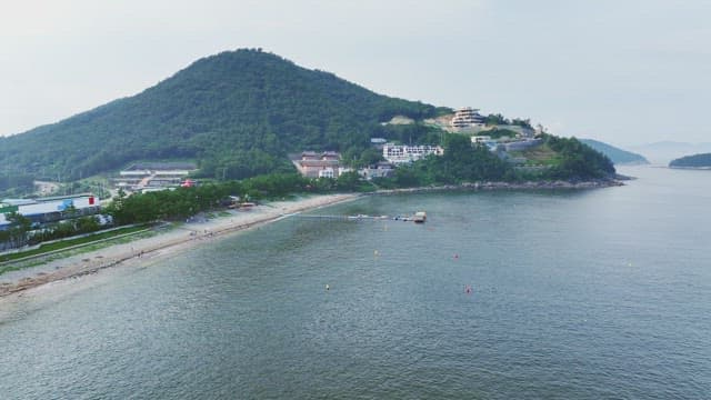 Coastal village with a mountain backdrop