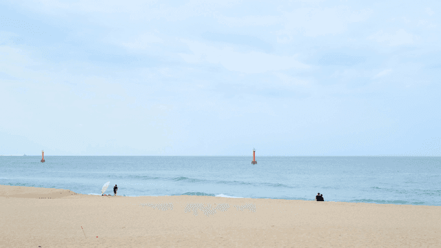 Rranquil beach with distant buoys
