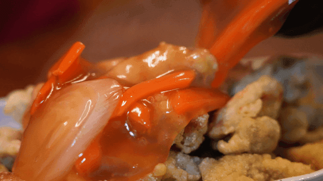 Sweet and sour sauce poured over fried pork