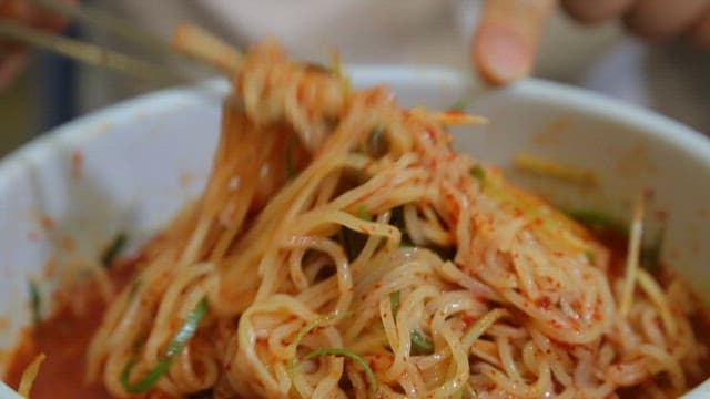 Mixed vegetables and chewy noodles in a bowl