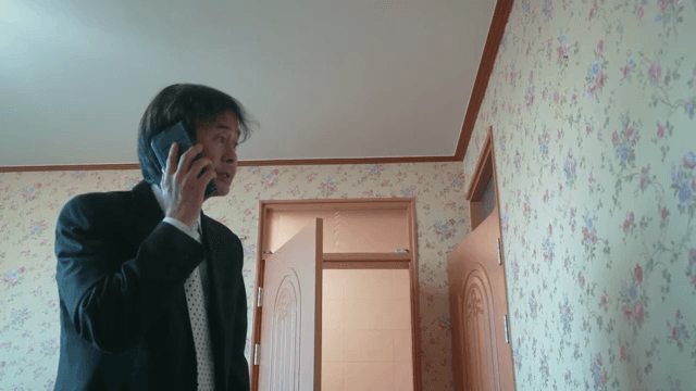 Man runs into the room and answers the phone