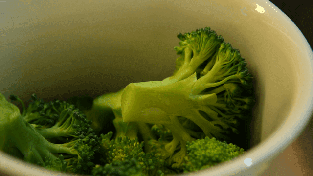 Fresh broccoli in a white bowl