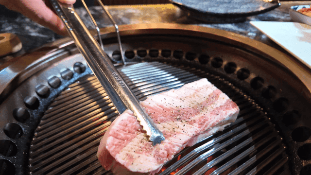 Thick pork belly on grill