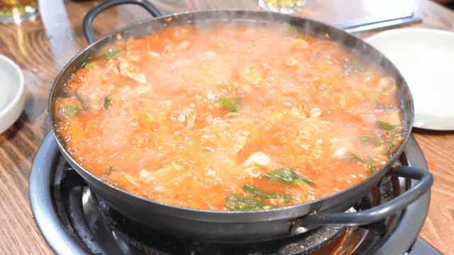 Spicy chicken offal stew boiling in pot
