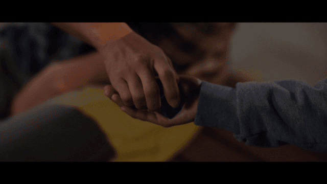 Person who hands me small blue earplugs