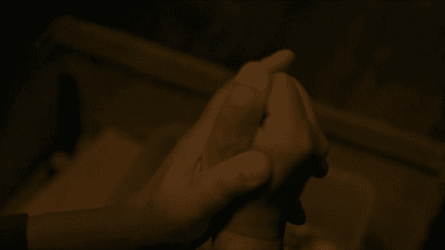 Hands of person praying modestly with both hands clasped together