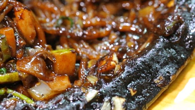 Seafood Jjajangmyeon pressed onto an iron plate