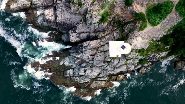 Lighthouse on a Rugged Coastal Cliff