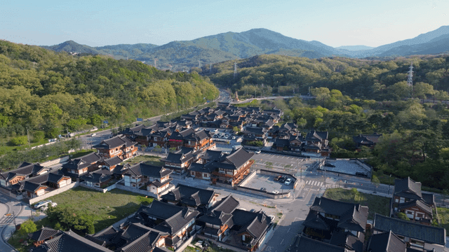 Traditional hanok village surrounded by mountains