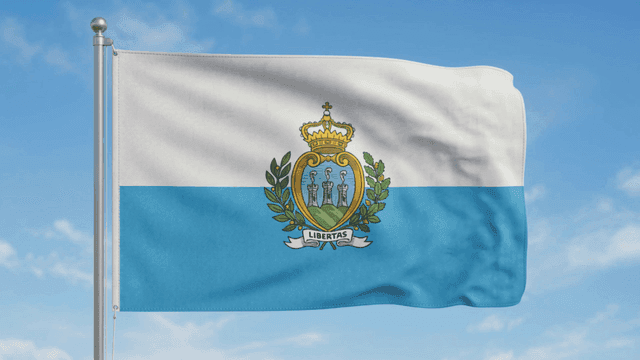 Flag of Republic of San Marino fluttering under clear sky