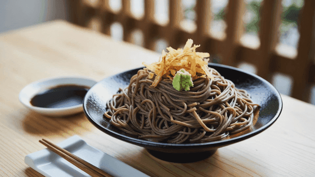 Plate of soba topped with garnish