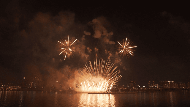 Fireworks display over a city skyline