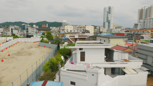 Village scene with mixed housing and construction sites