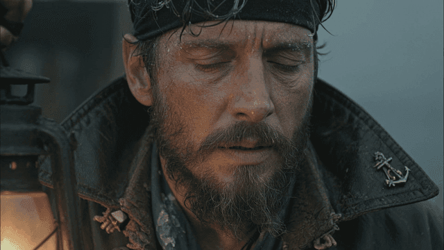 Rugged medieval pirate man holding lantern
