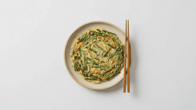 Chive pancake placed with chopsticks