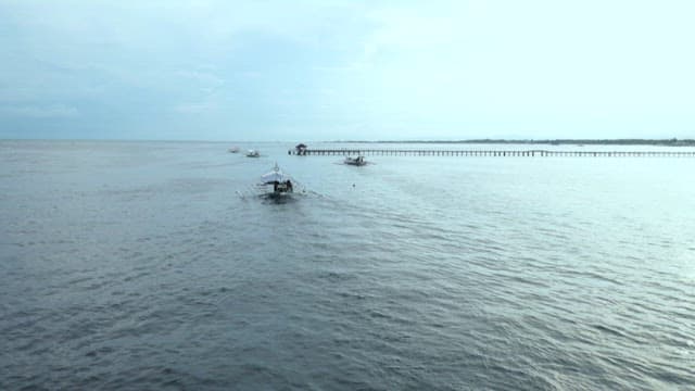 Bangka, a traditional Filipino boat floating on the peaceful and vast sea