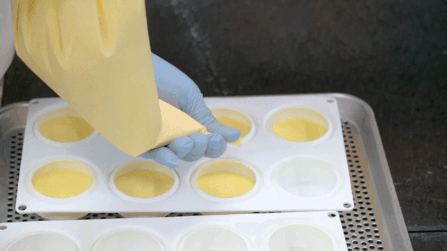 Filling molds with yellow batter