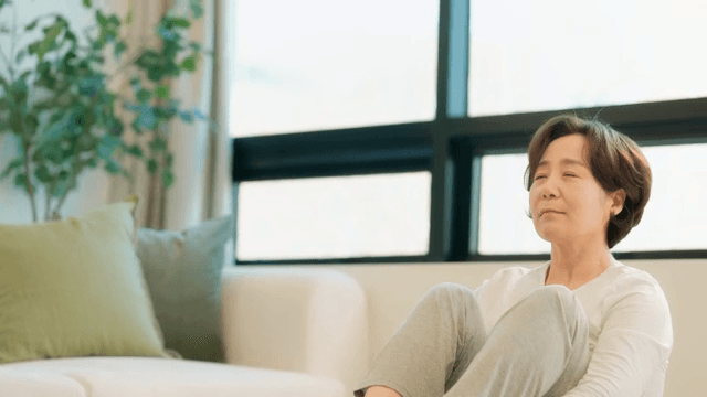 Woman practicing yoga indoors