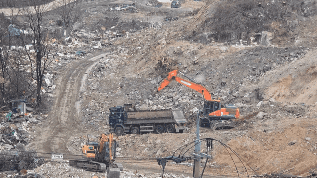 Construction site with excavators and trucks