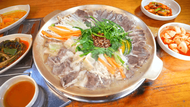 Hot stew with various side dishes