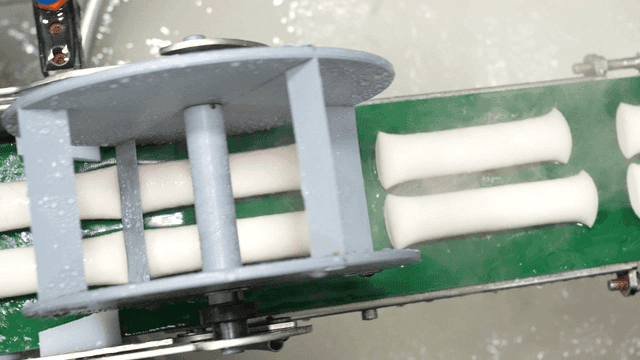 Rice cakes being processed in a factory