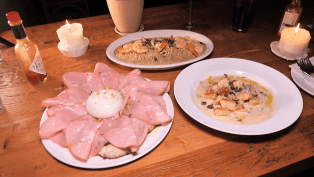 A cozy dinner setting with Italian dishes