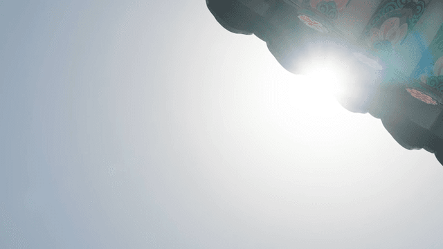 Traditional Korean house roof eaves with sunlight shining through them