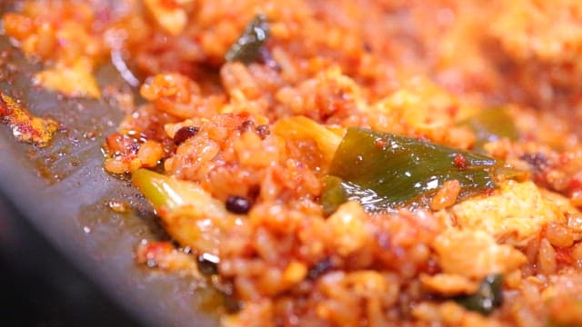 Fried rice sizzling on a pan