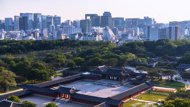 Cityscape with modern skyline and historic palace