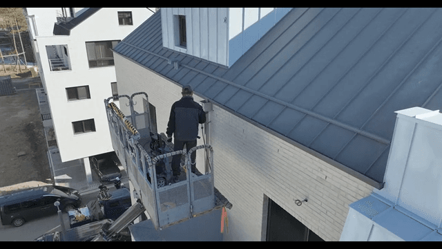 Worker on a lift at a building site