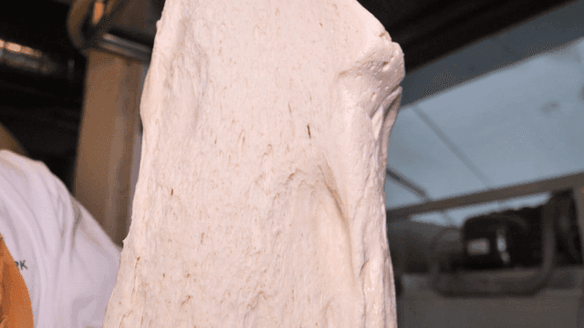 Stretching dough in a kitchen