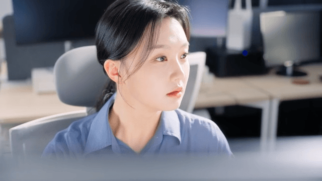 Woman working at a desk in an office