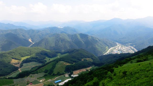 Vast mountain landscape with agricultural fields