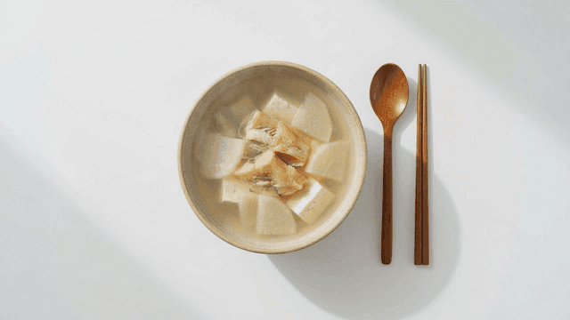 Bowl of clear dried pollack soup with radish and fish