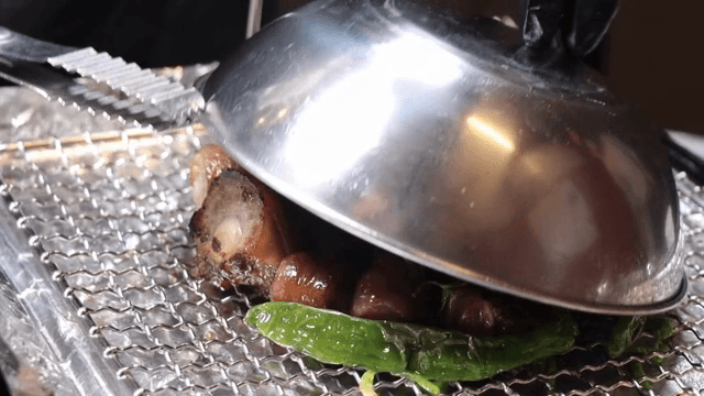 Pork tail stew on wire mesh