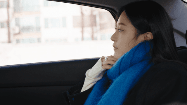 Woman in a taxi looking outside