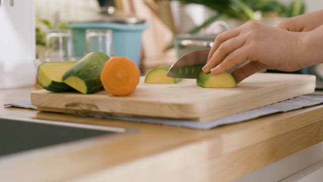 Cutting Zucchini with a Knife to Prepare Dishes