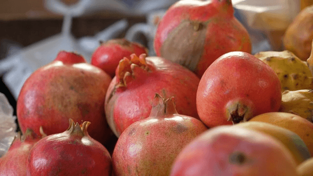 Fresh pomegranates on display at a market