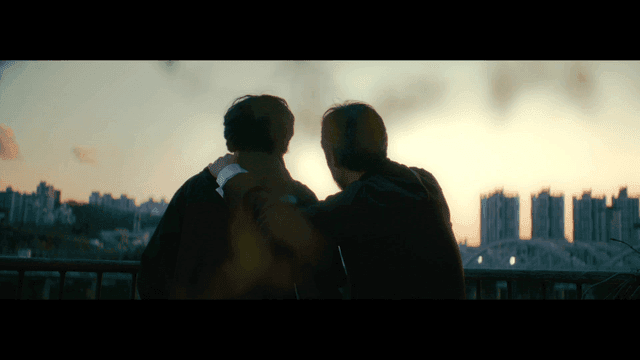 Two friends watching the sunset