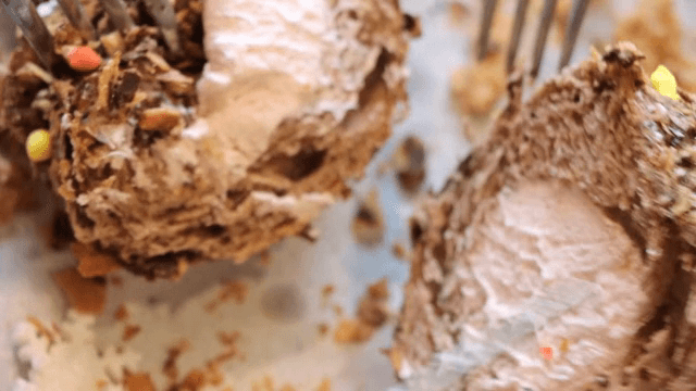 Fork cutting into a chocolate dessert