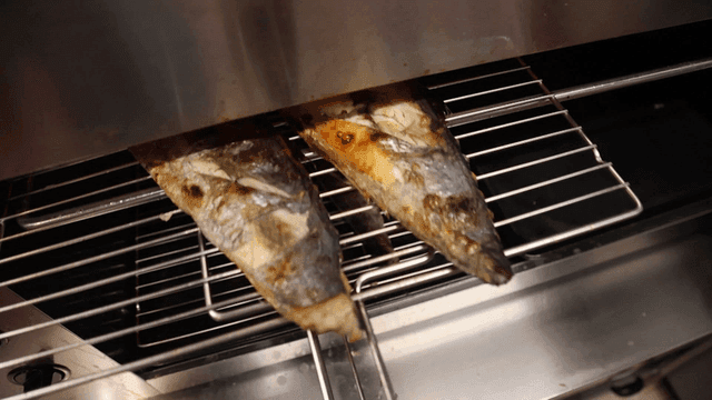 Spanish mackerel being baked in oven